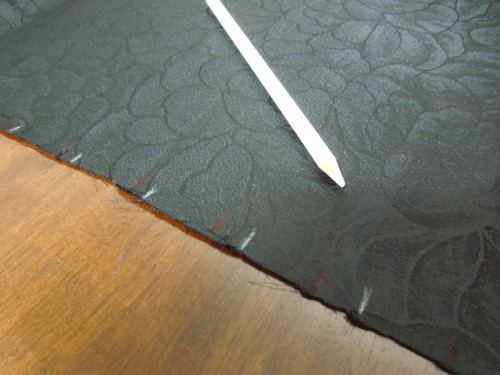 Use a white pencil to make marks on the fabric