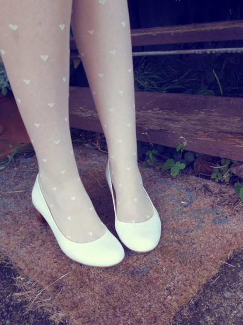 White heart-print tights from Forever New and white kidskin leather heels from Mascotte